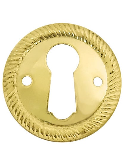 Stamped Brass Round Keyhole Cover with Rope Design in Un-Lacquered Brass.